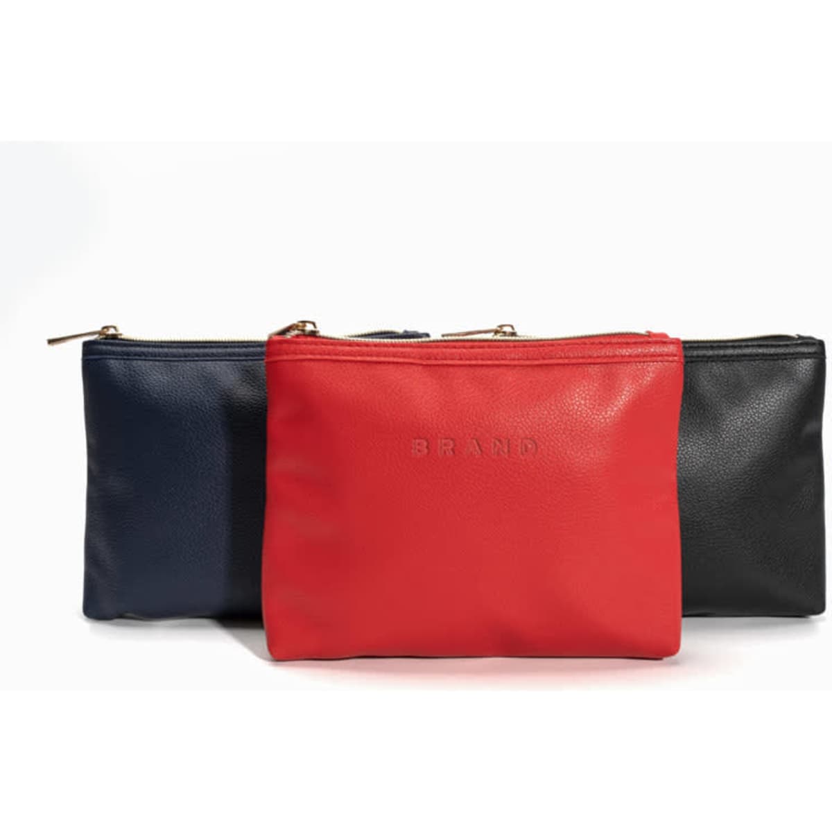 A set of three travel cosmetic bags in red, navy, and black, featuring a zip closure and a logo.