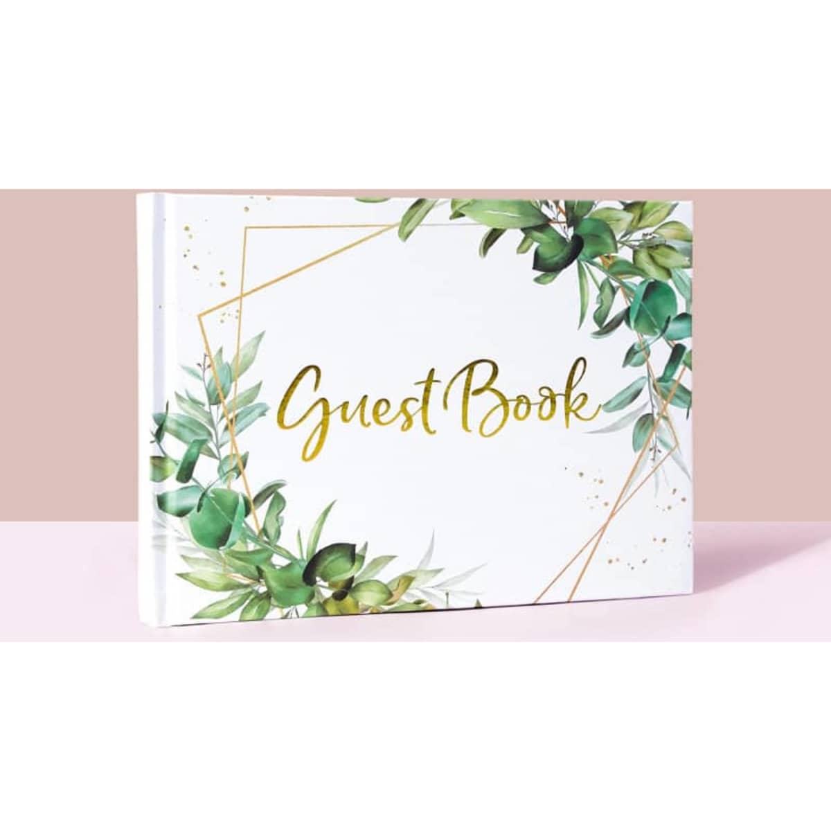 A guest book set featuring a white cover adorned with green foliage and gold accents.