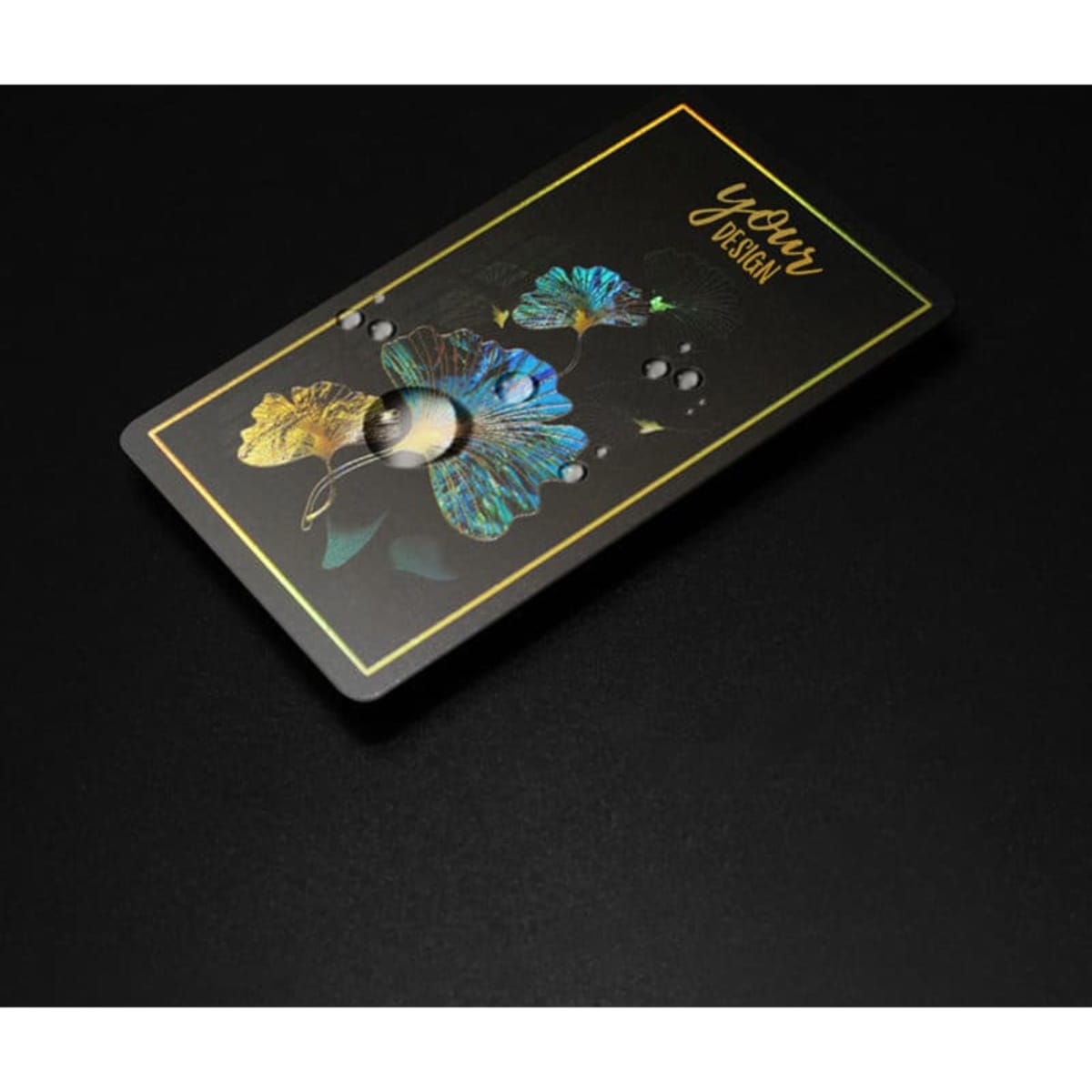 A vibrant holographic rainbow business card featuring floral designs on a black background, with a gold border.