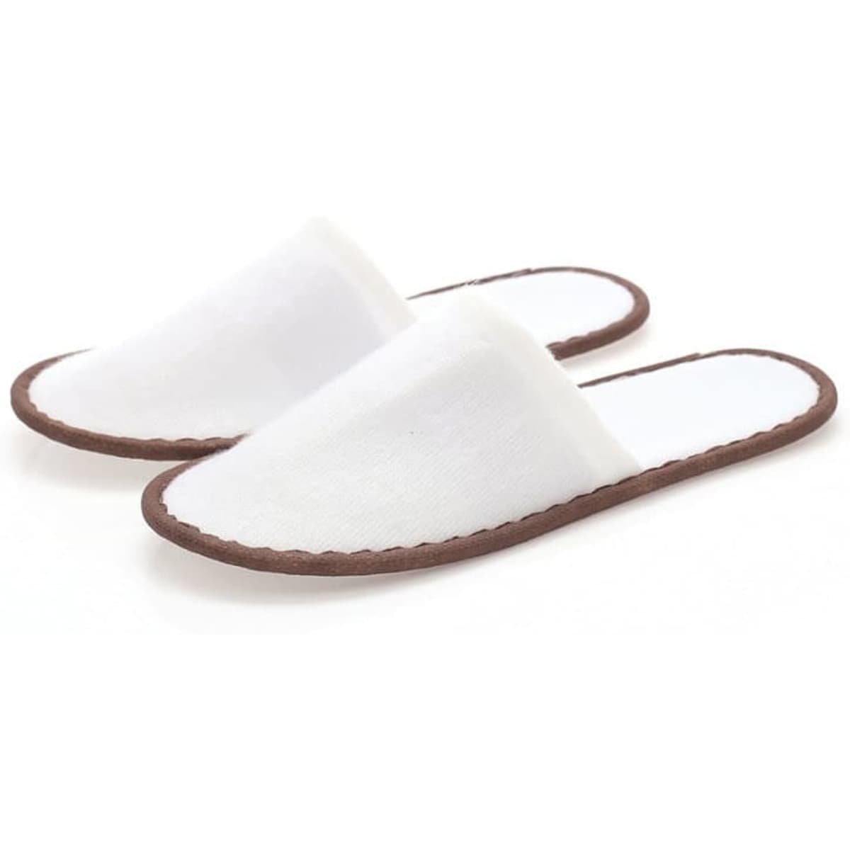 A pair of white non-slip disposable slippers with a brown sole. The slippers have a simple, unembellished design.