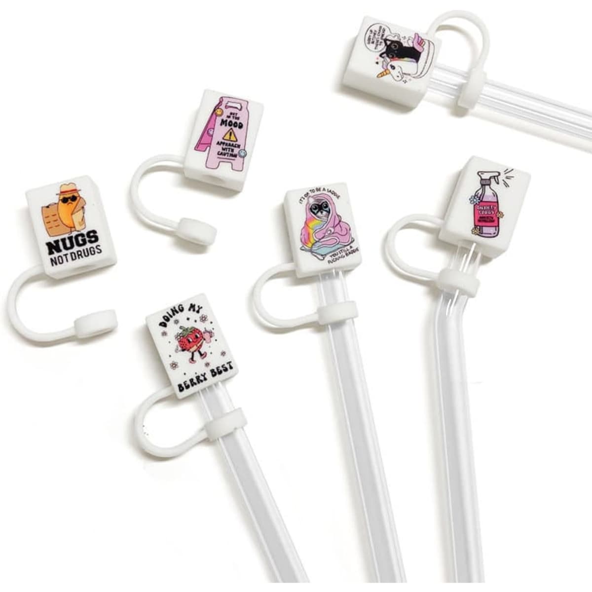 A set of custom silicone straw cover caps in various designs, featuring vibrant colours and playful graphics, with white straws.