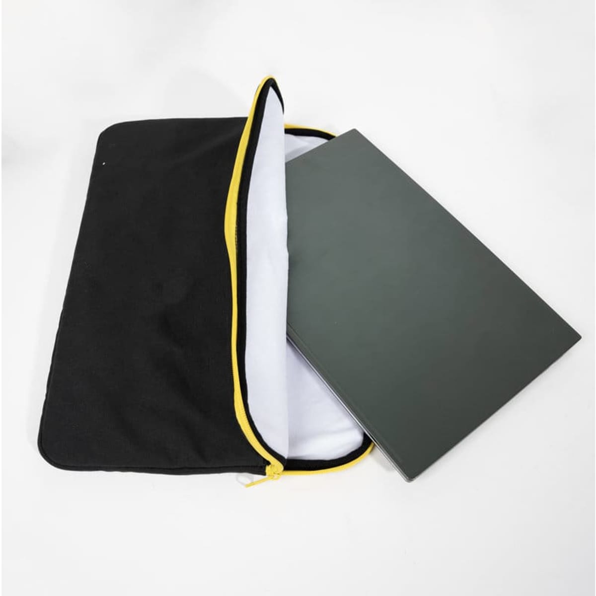 A black 14-inch protective laptop sleeve with a white interior and a yellow zipper, holding a laptop.