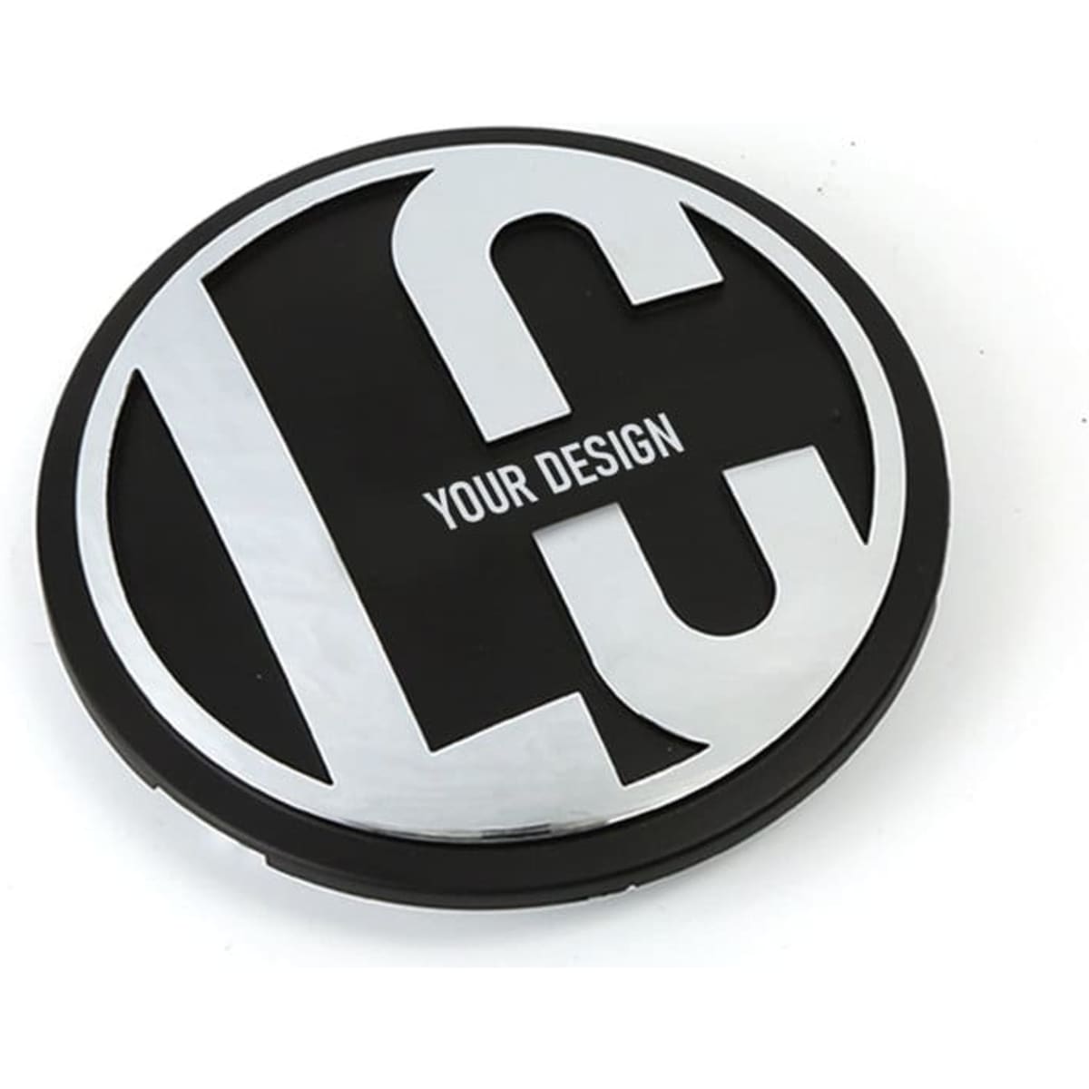 A round, black car emblem with a silver logo and space for personalised design.