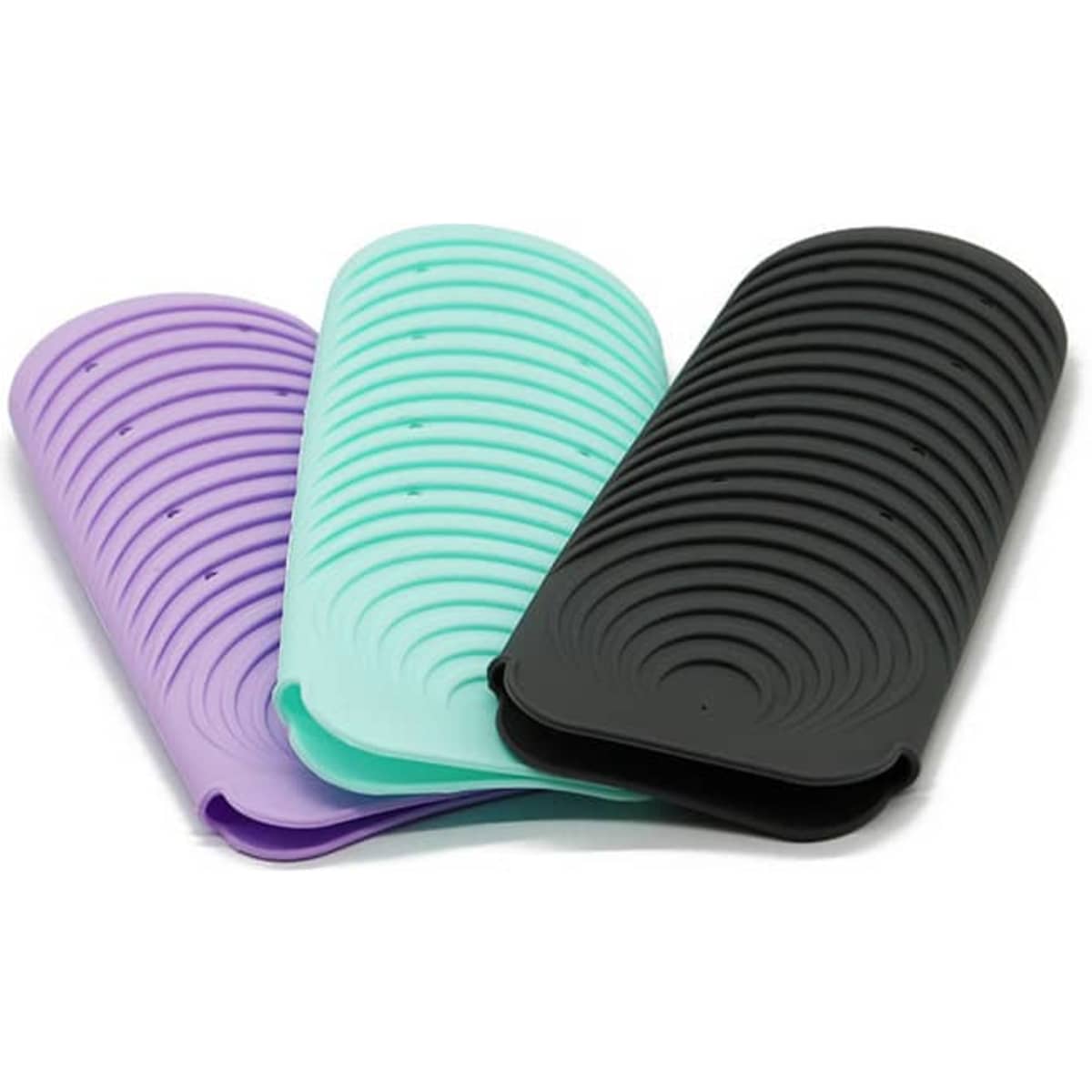 A set of three silicone mats in purple, mint green, and black, designed to be heat resistant.