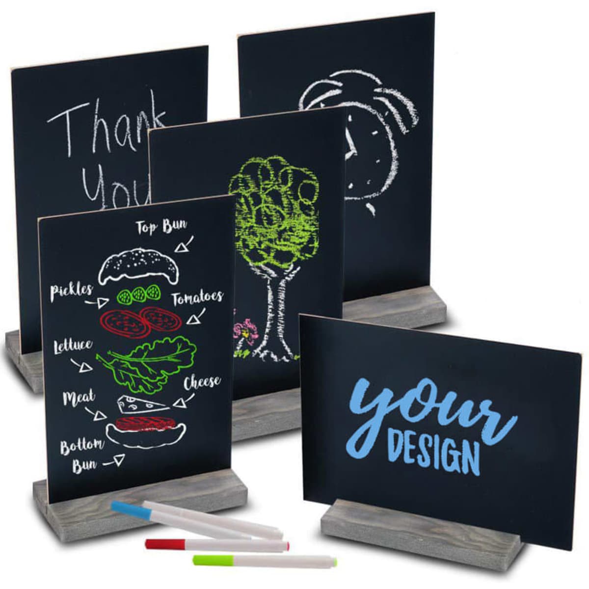 A set of tabletop chalkboard signs with wood bases in black, featuring various colourful chalk designs and markers.