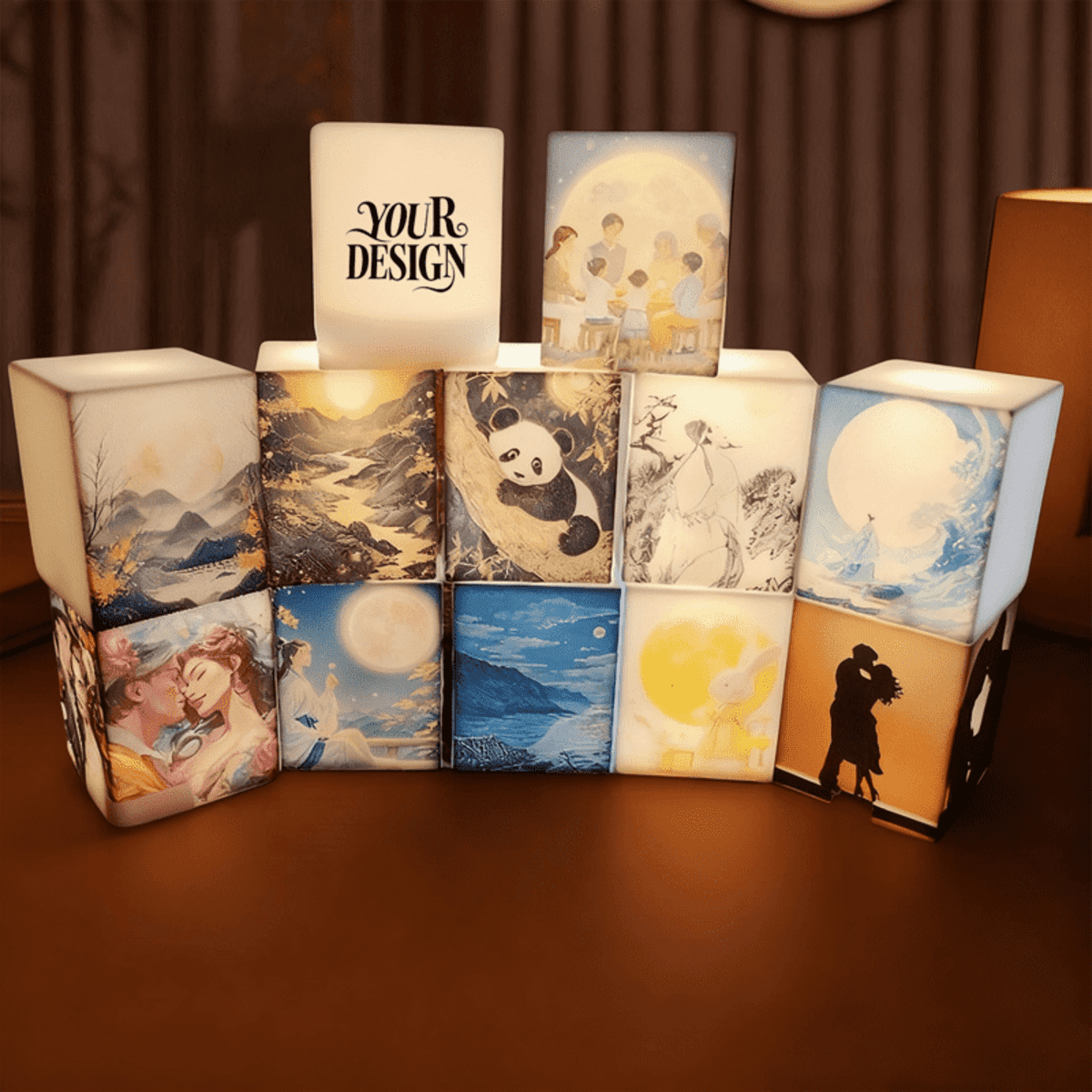 A set of illuminated silicone cube night lights featuring various artistic designs in soft white and pastel colours.