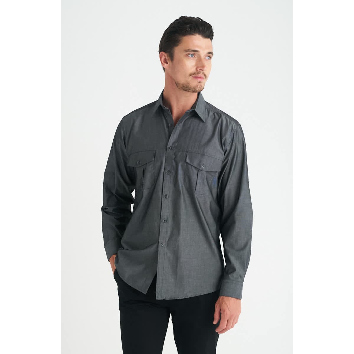 A men's long sleeve button-up shirt in grey, featuring two chest pockets and a simple design.