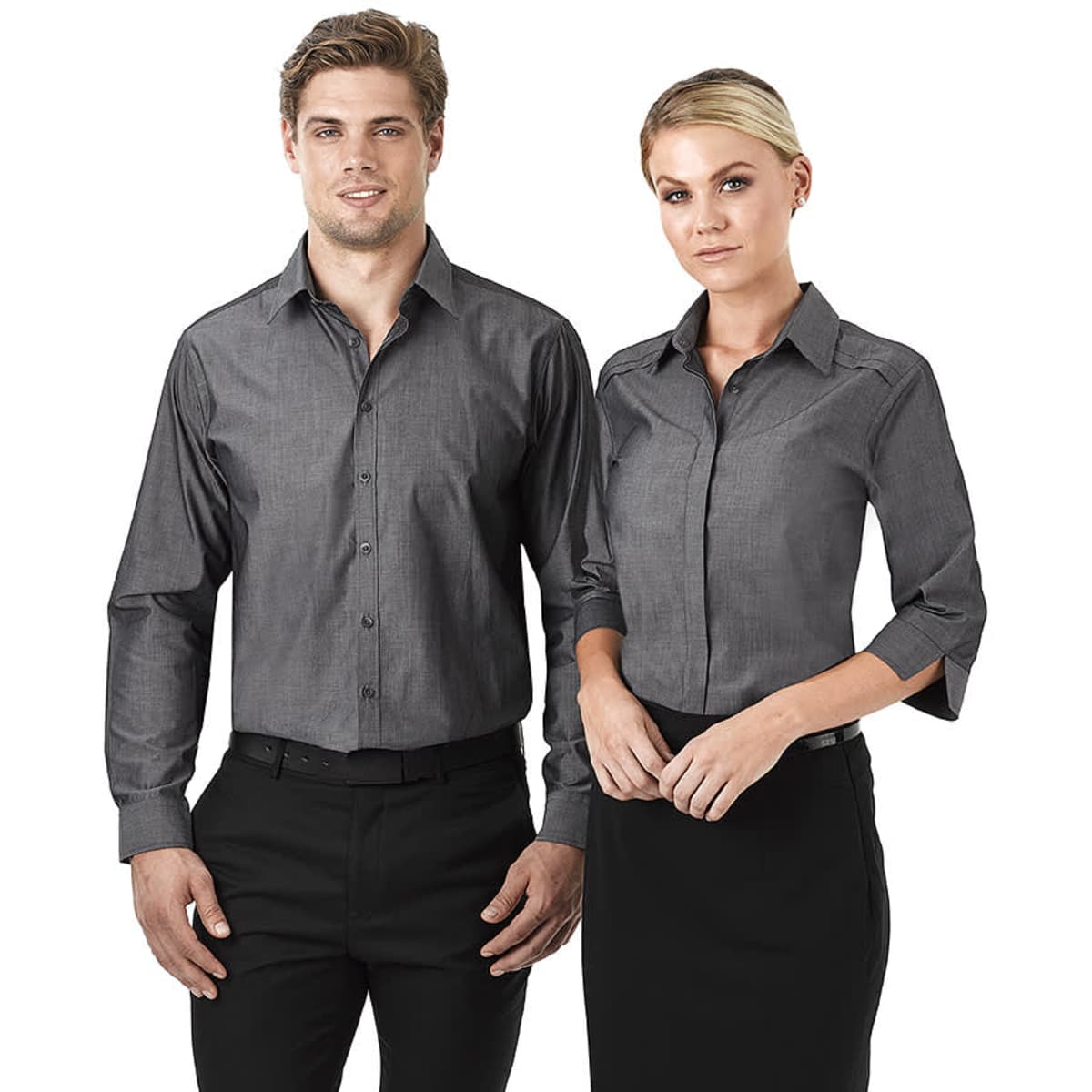 A grey, button-up long sleeve shirt for ladies, displayed on a model alongside a male model in a matching style.