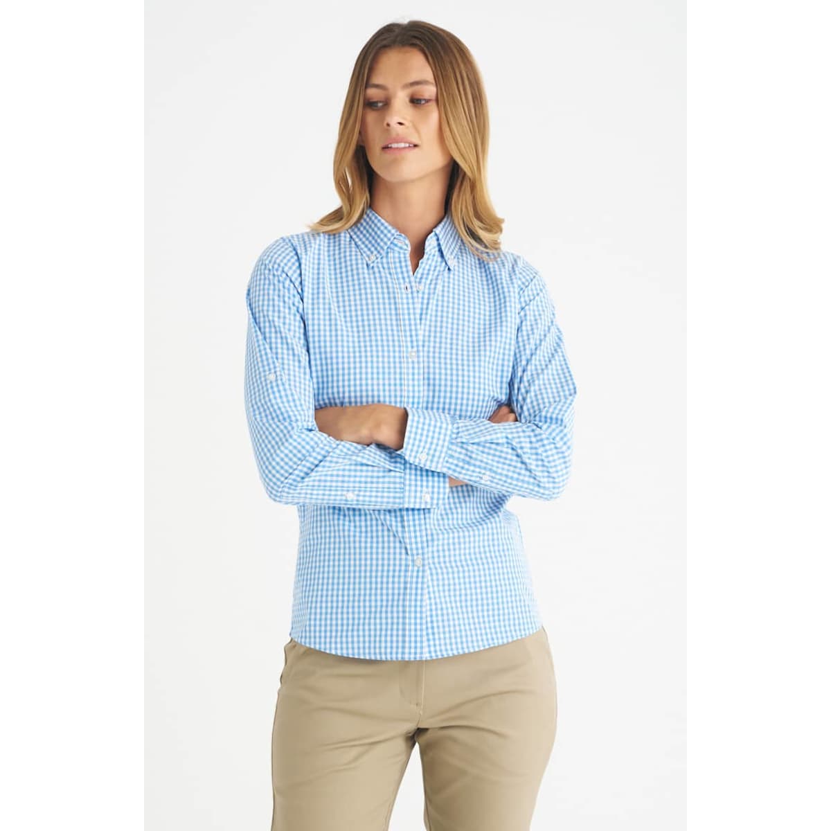 A blue checked long sleeve button-up shirt for ladies, featuring a collar and fitted design. It has a logo.