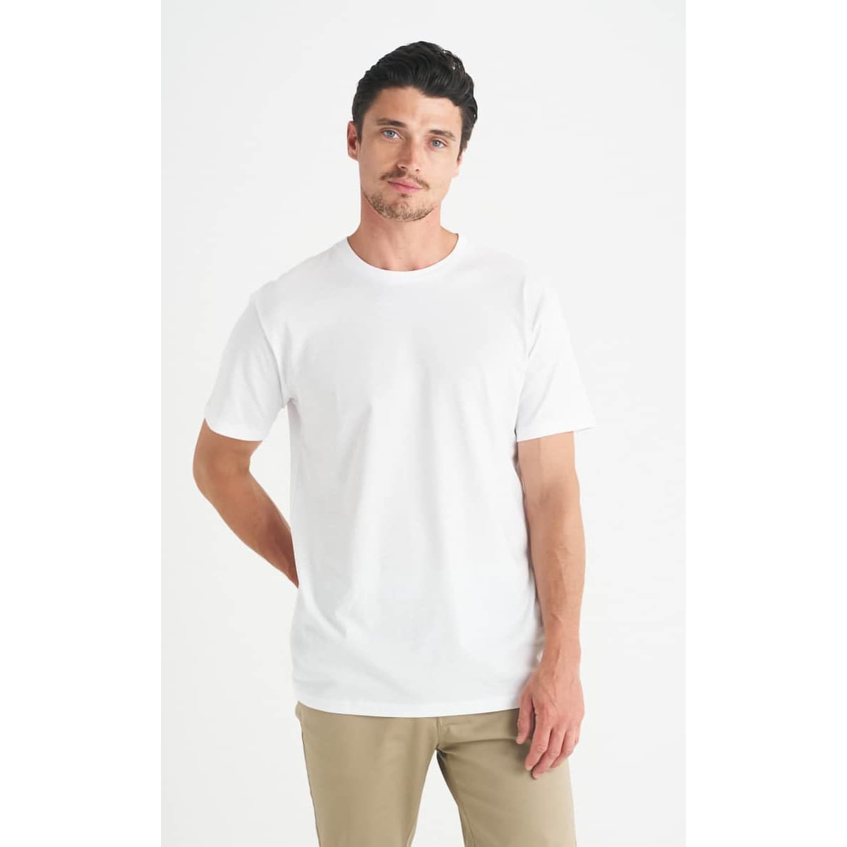 A white men's t-shirt displayed on a model, with a plain design and no visible branding.