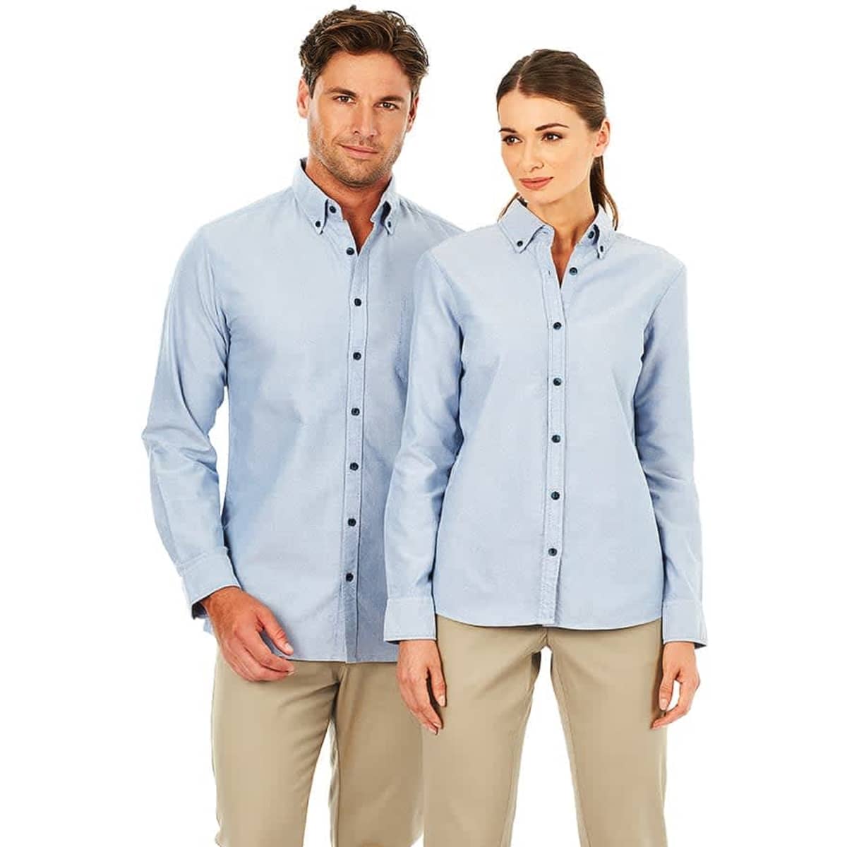 A light blue long sleeve button-up shirt for ladies, featuring a collar and a logo. Suitable for casual or smart attire.