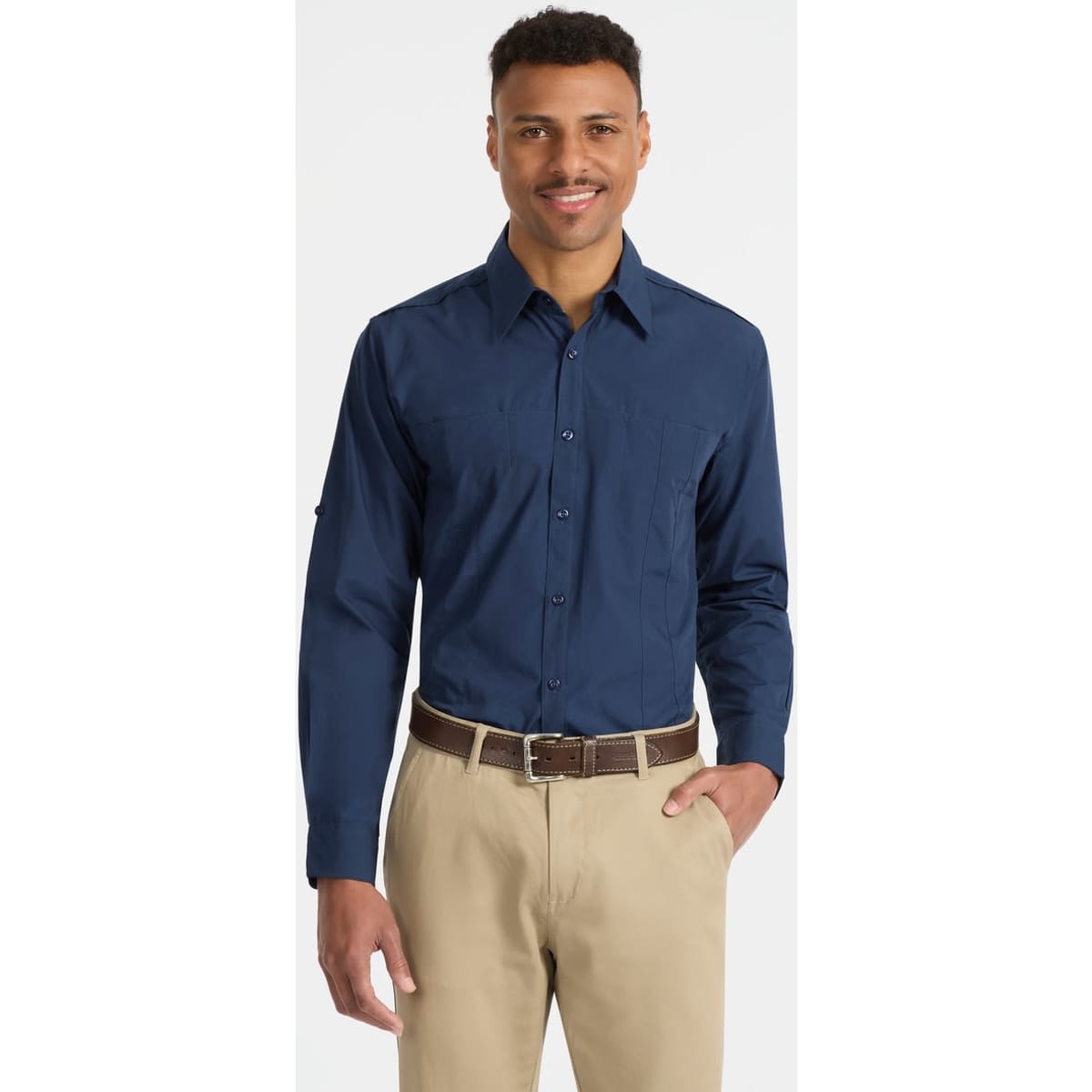 A navy blue long sleeve button-up shirt for men, featuring a logo, with a model smiling while wearing it.