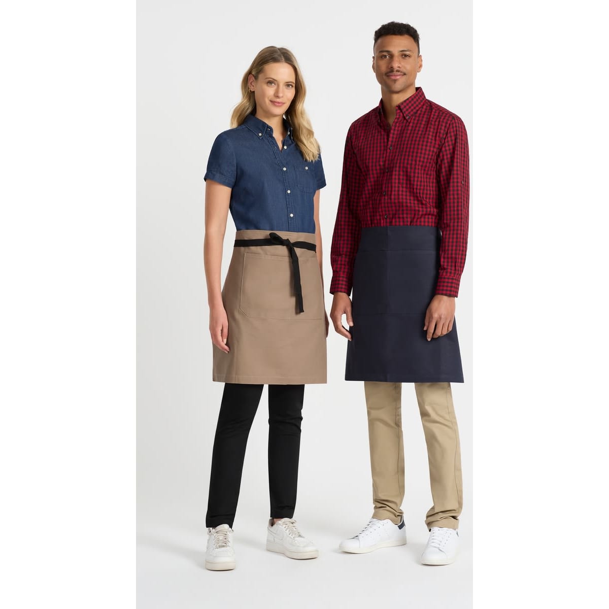 A ladies short sleeve button-up shirt in denim blue, paired with a male model in a red and black check shirt.