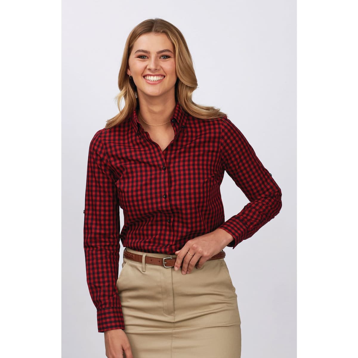 A ladies' long sleeve button-up shirt in red and black check pattern, featuring a fitted design and logo.