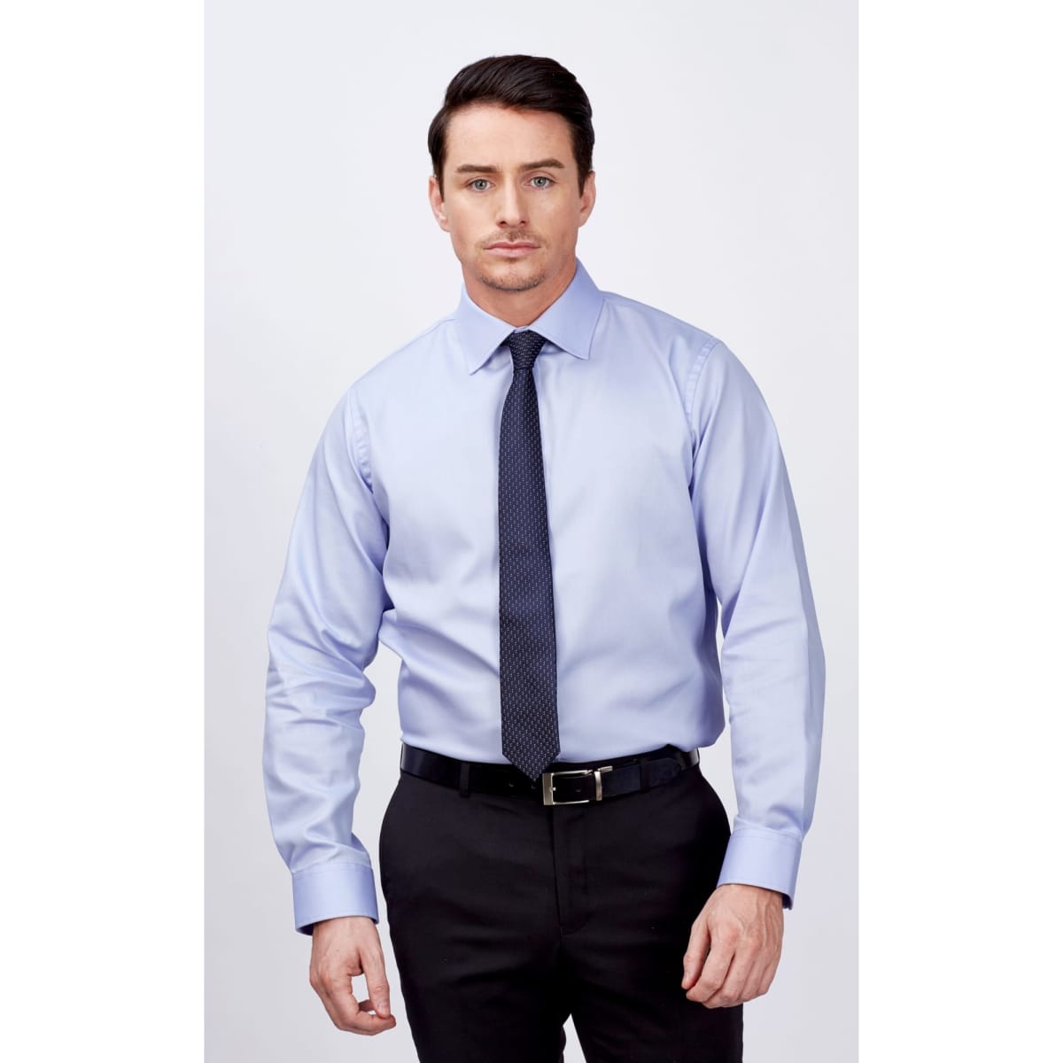 A long sleeve button-up shirt in light blue, featuring a collar and a sleek, professional look.