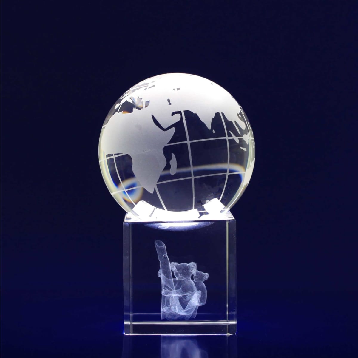 A 60mm crystal spinning globe featuring a clear design with geographical outlines, set on a transparent base.