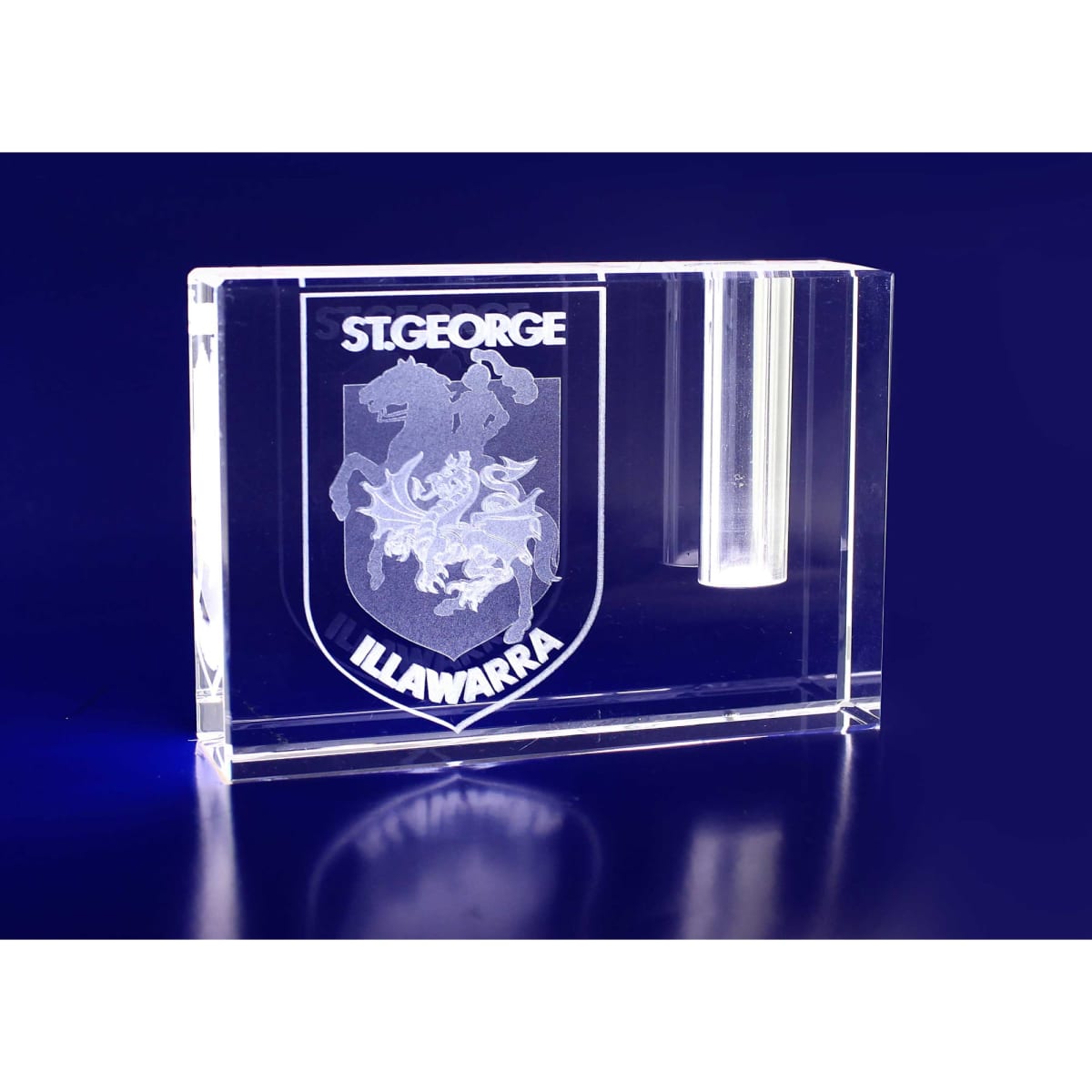 A clear crystal rectangle pen holder featuring an engraved logo, designed for business cards in a blue background.