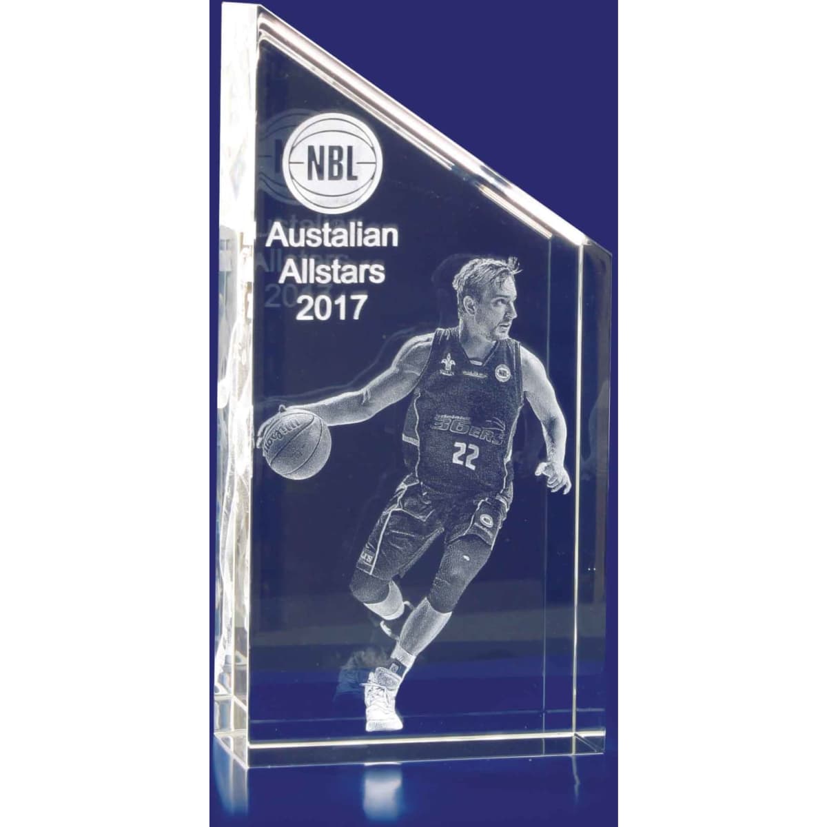 A crystal rectangular trophy with a sloped top, featuring a 3D image of a basketball player in action. Clear and detailed design.