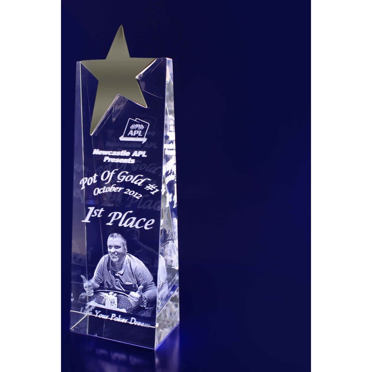 A 3D crystal star wedge trophy in clear with a star design on top, featuring engraved details.
