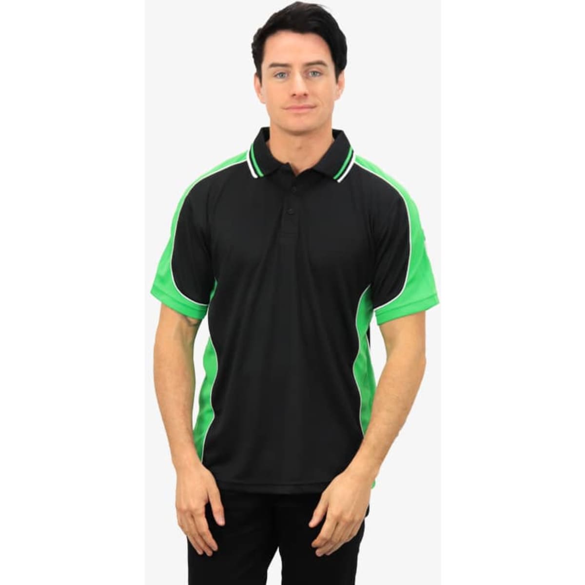 A black and green polo shirt featuring a logo, displayed on a model with a neutral background.