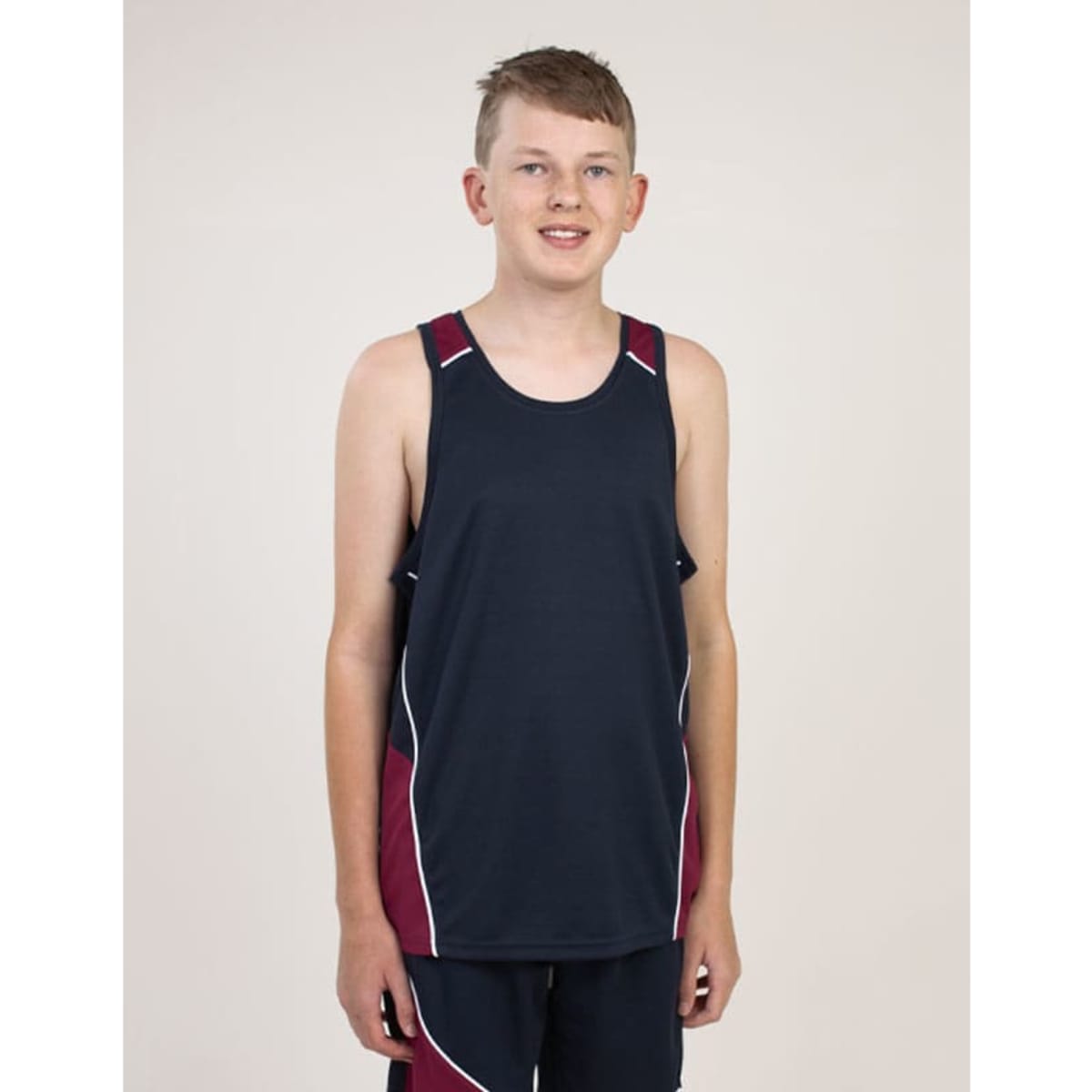 A navy and maroon singlet with contrasting white stitching, displayed on a model. Features a branding logo.
