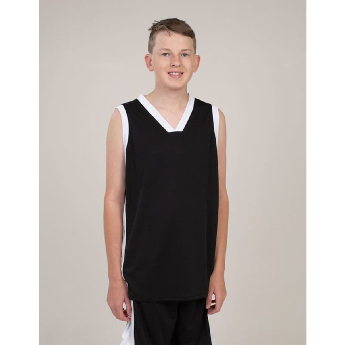 A black singlet with white accents, featuring a v-neck design, worn by a young model. Logo present.