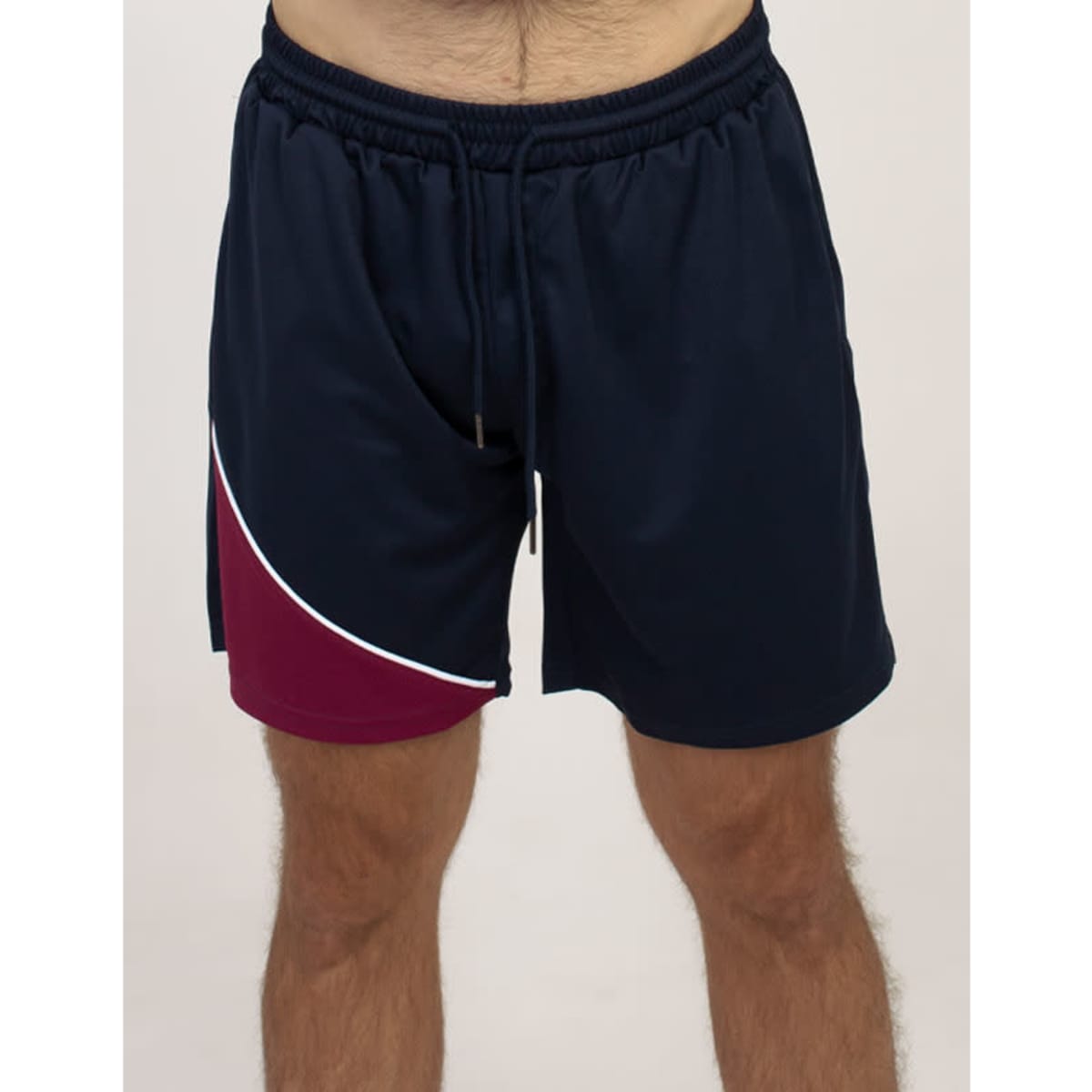 Sports shorts in navy blue with a maroon panel and white detailing. Features an elastic waistband and a drawstring.