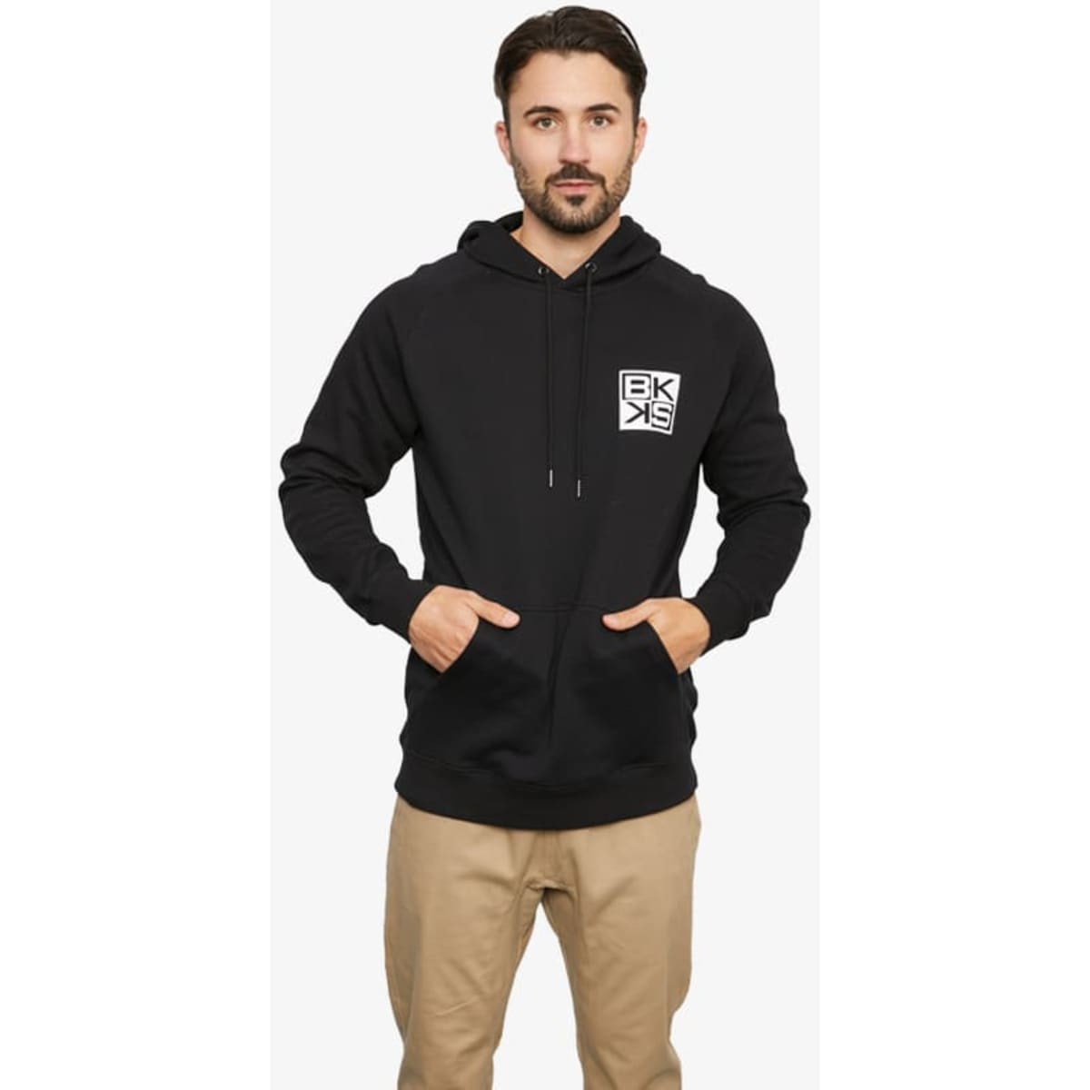 A black hoodie with a front pocket and a logo on the left chest, worn by a male model.