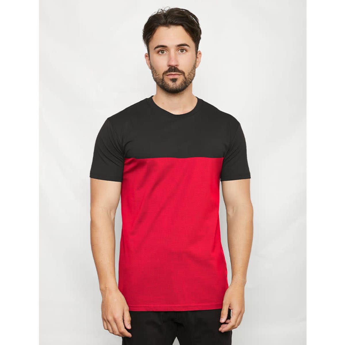 A two-toned T-shirt featuring a black top half and a red bottom half, with a model wearing it.