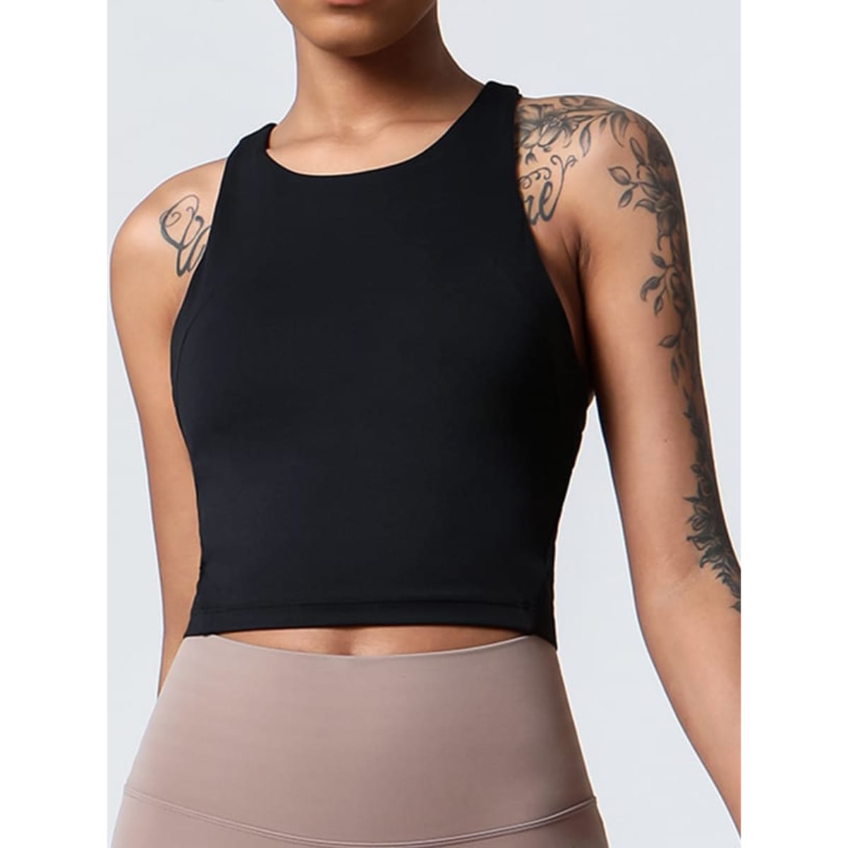 A black ladies' crop top with a fitted design, featuring a sleeveless cut and a logo on the front.