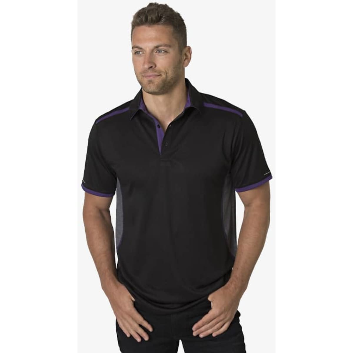 A black polo shirt with purple accents and a logo on the chest, modelled by a man.