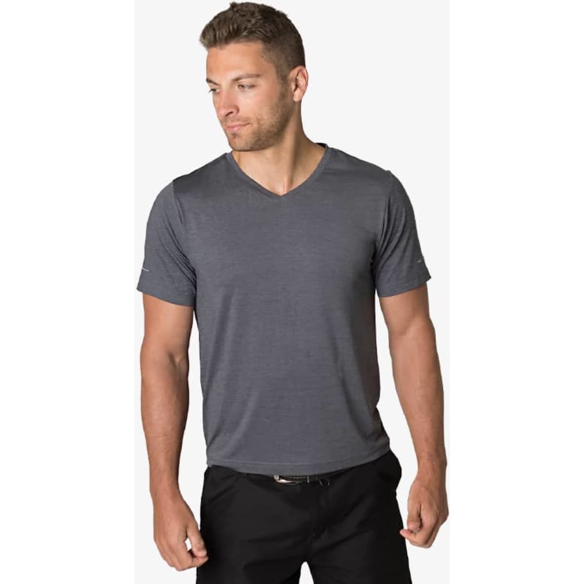 A grey v-neck t-shirt worn by a man, featuring a subtle design and a logo on one sleeve.