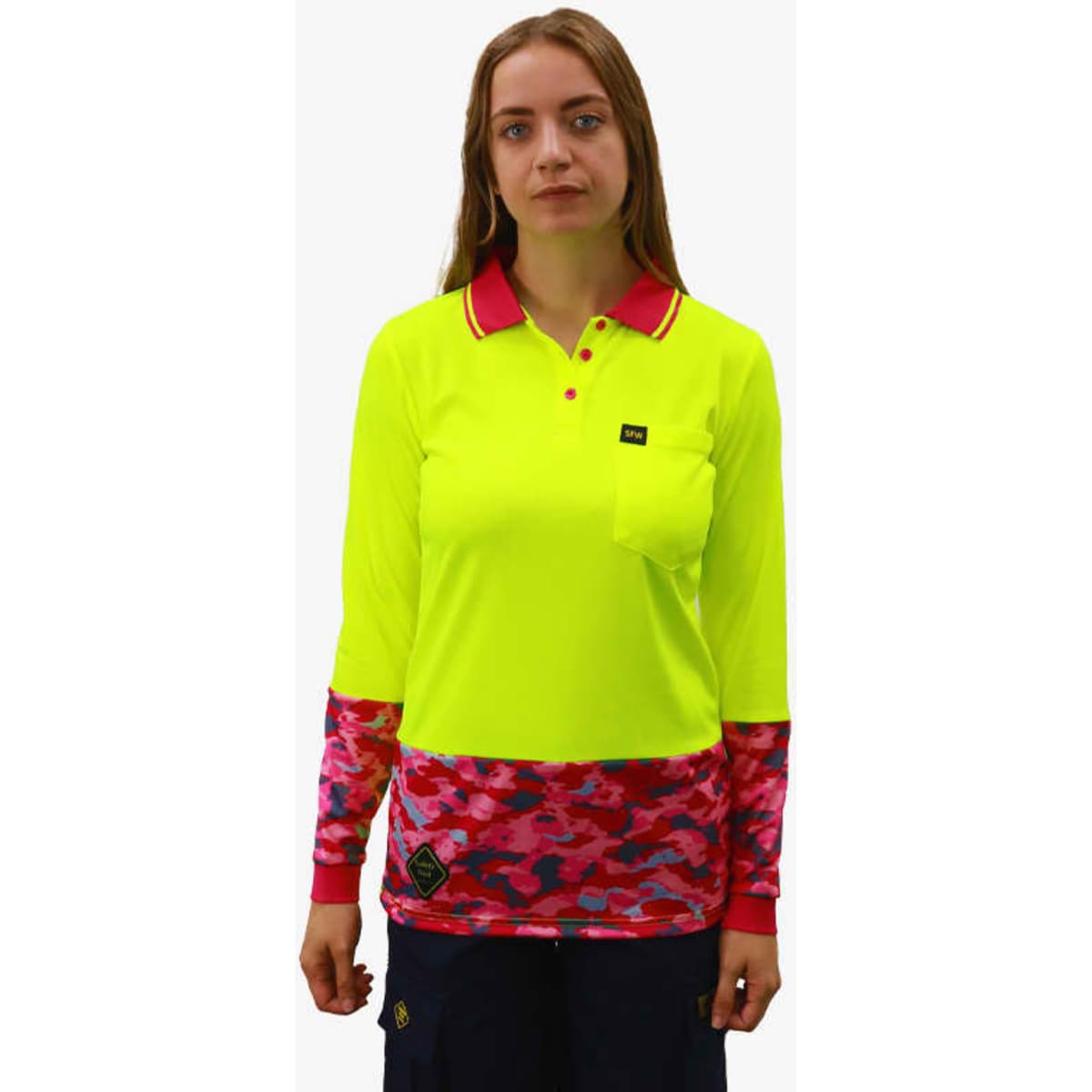 A bright yellow polo shirt with long sleeves, featuring a pink camouflage pattern on the lower half and a logo.
