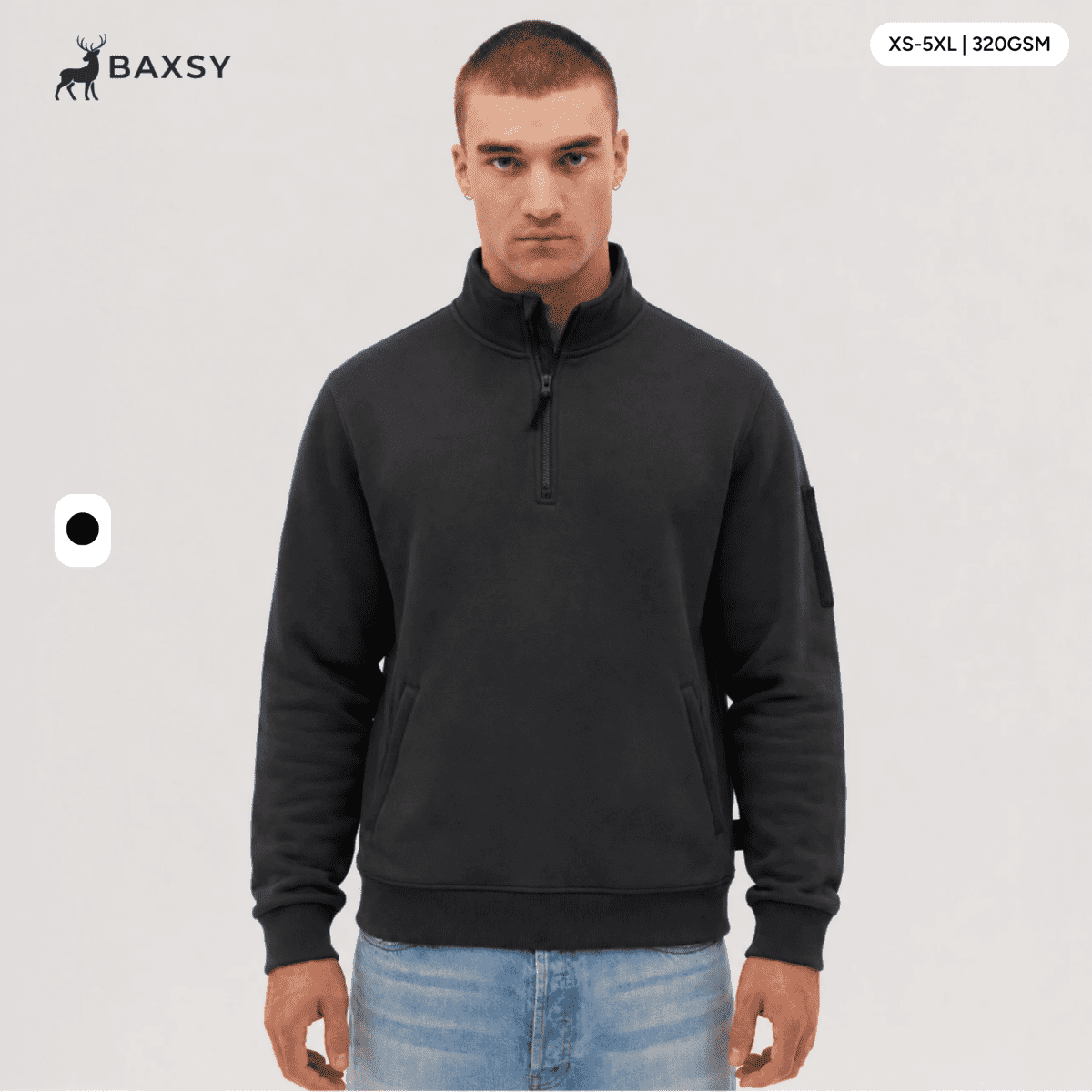 A 1/4 zip fleece in dark grey, featuring a logo on the sleeve. Model displays the product against a neutral background.