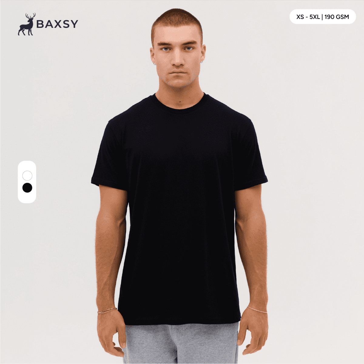A black t-shirt is displayed on a model, featuring a round neck and short sleeves, with a logo visible.