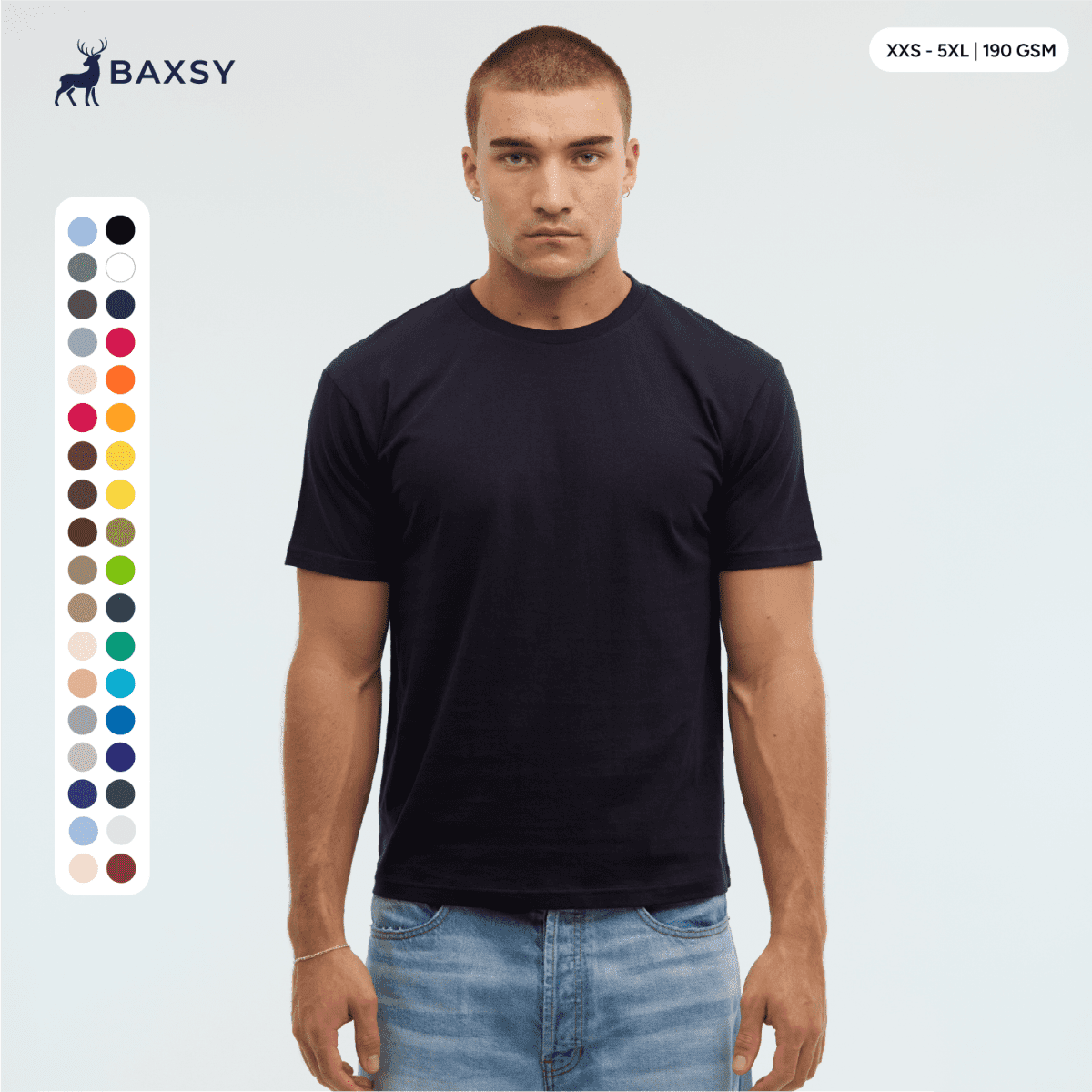 A model wears a navy blue Essential/Surf Tee, featuring a range of colour swatches on the side and a logo at the top.