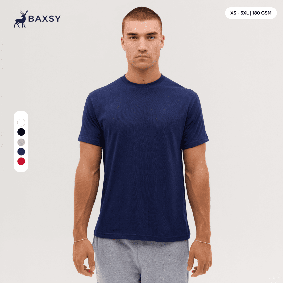 A navy blue T-shirt displayed on a model, featuring a round neckline and short sleeves. It has a logo.