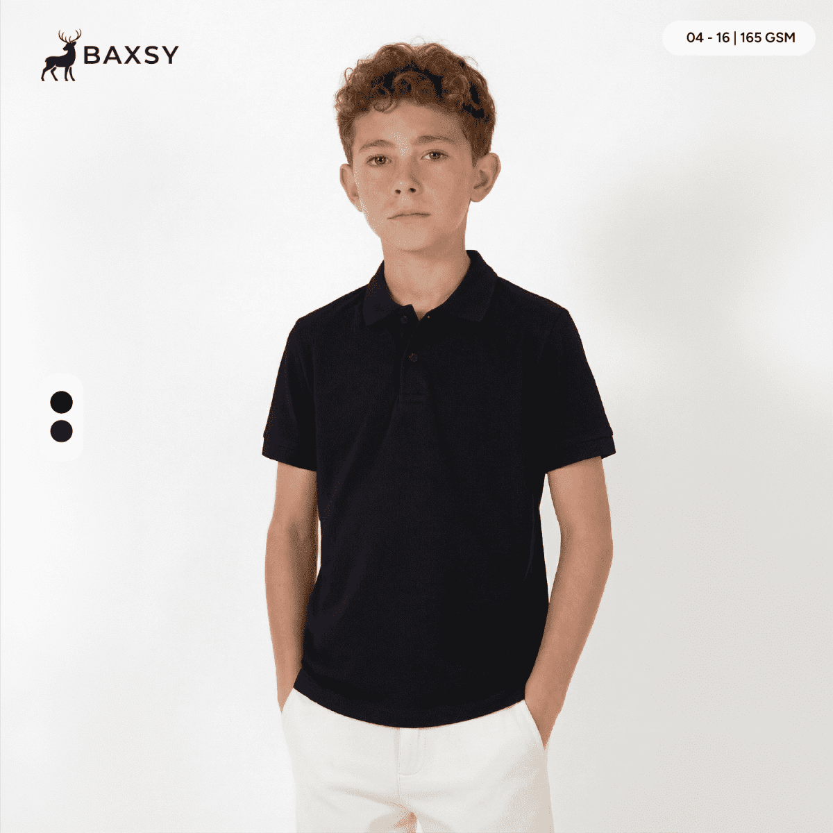 A black youth polo shirt with a collar, displayed on a model against a plain background. Features a logo.