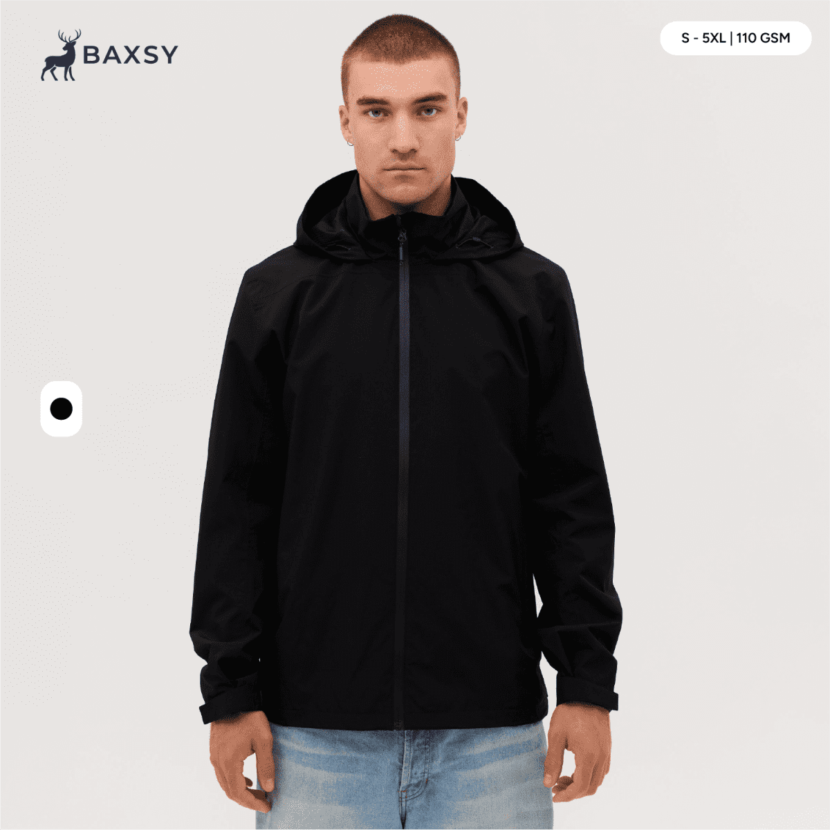 A man wearing a black Core Weather Jacket, featuring a hood and front zip, stands against a neutral background.