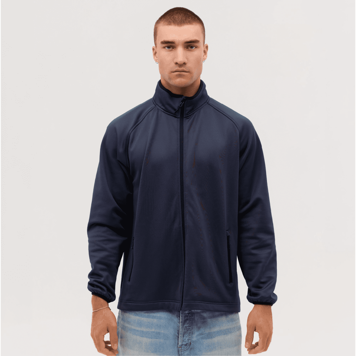 A navy Summit Bonded Jacket on a male model, featuring a zip front and a collar, with a logo.