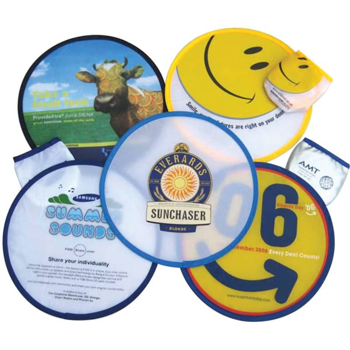 A collection of colourful foldable nylon fun flyers, featuring smiley faces and various designs, with one logo visible.