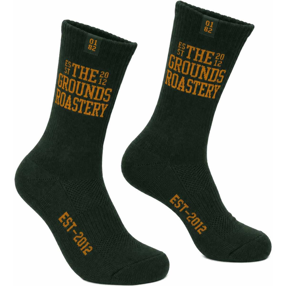A pair of dark green crew socks featuring yellow text and a logo. Suitable for casual wear.
