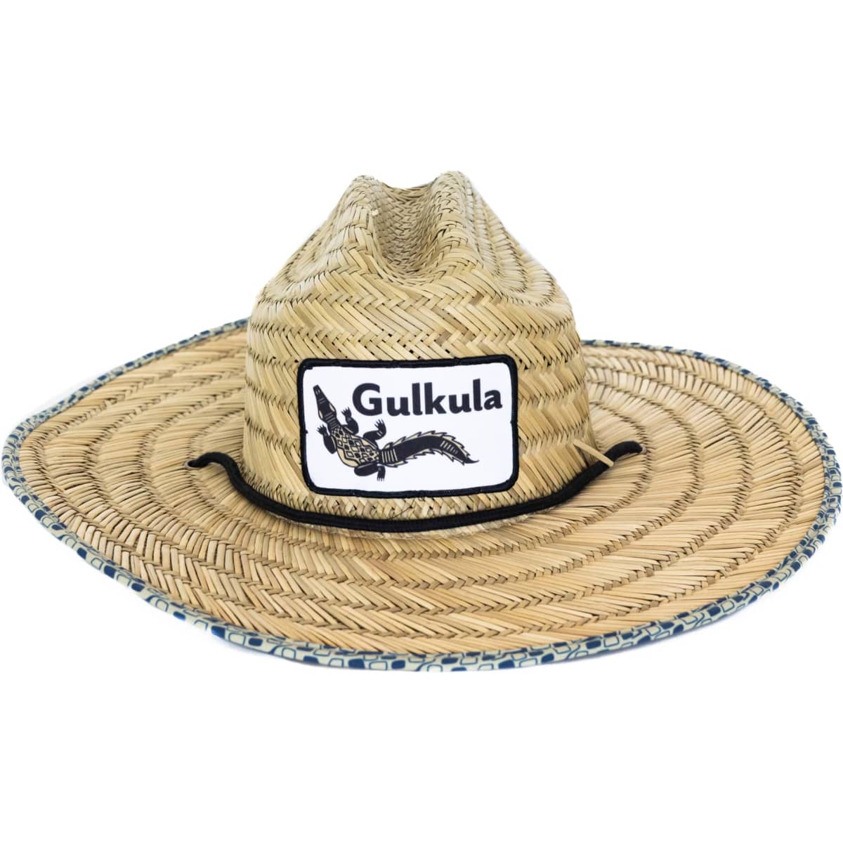 A straw hat with a wide brim, featuring a logo and decorative band around the base, in natural straw colour.