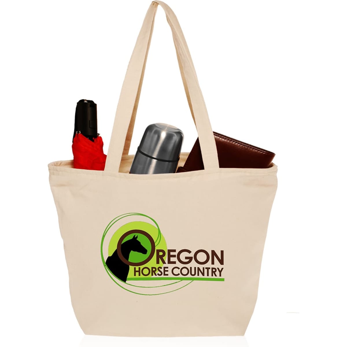 A cream cotton canvas tote bag with zipper closure, featuring a logo and holding a drink bottle, an umbrella, and a wallet.