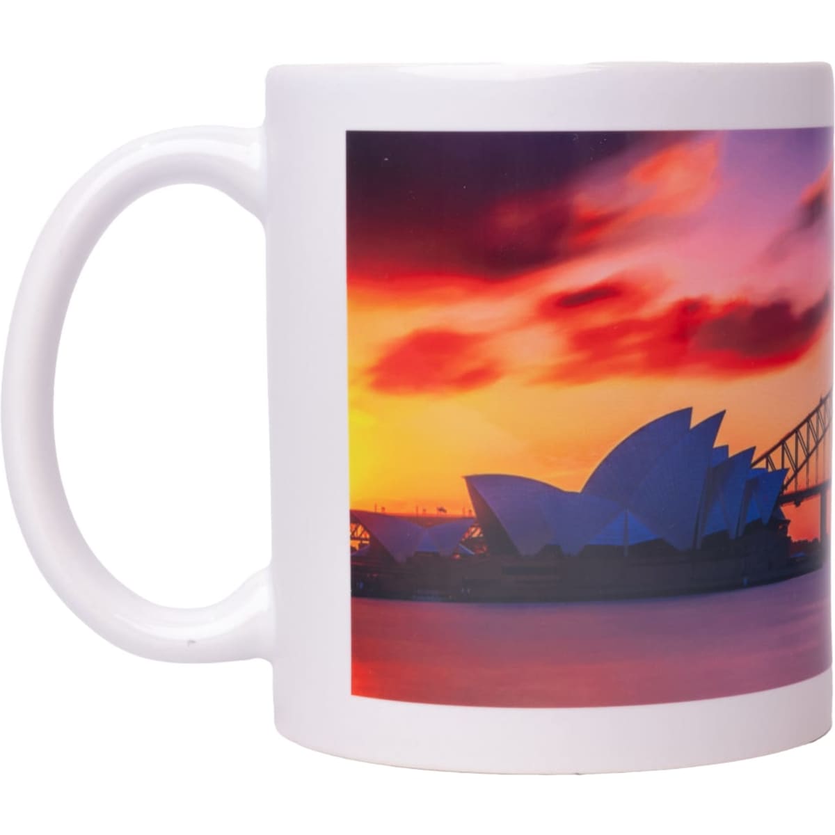 A white coffee mug featuring an image of the Sydney Opera House against a colourful sunset backdrop.