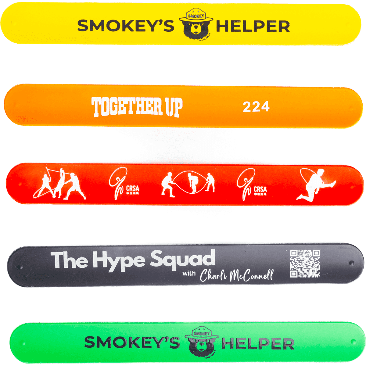 Five silicone slap-bands in yellow, orange, red, and green featuring various designs and a logo on each.