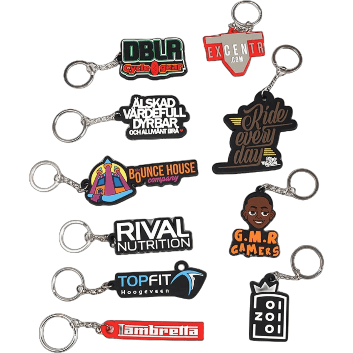 A collection of custom moulded PVC keyrings in various colours, featuring multiple designs and logos.