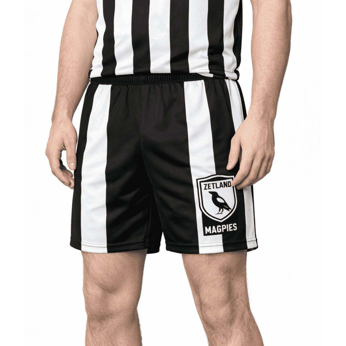 A pair of black and white sports shorts featuring a logo on the side and a striped design.