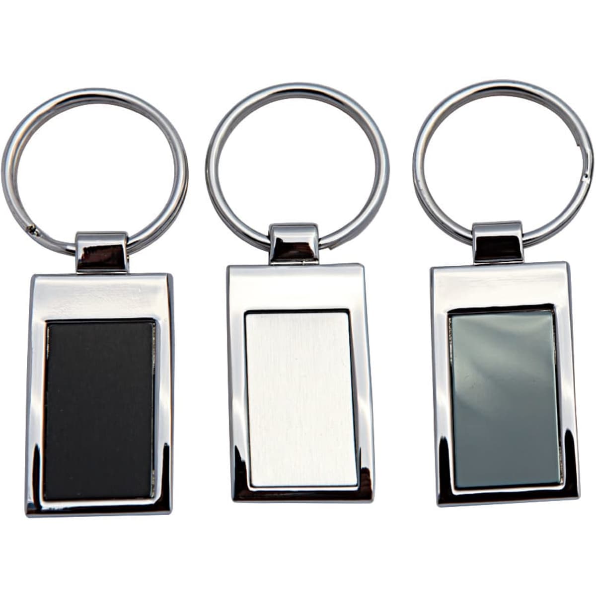 A set of three keychains with metallic frames, featuring black, silver, and grey rectangular sections.
