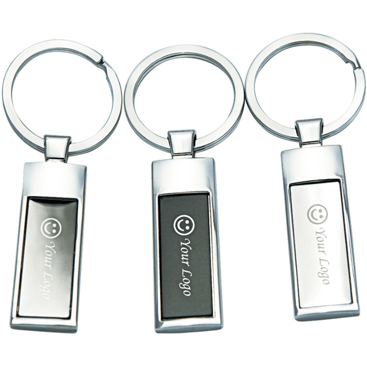 A set of three silver keyrings, featuring rectangular designs and a smooth finish, with branding on each.